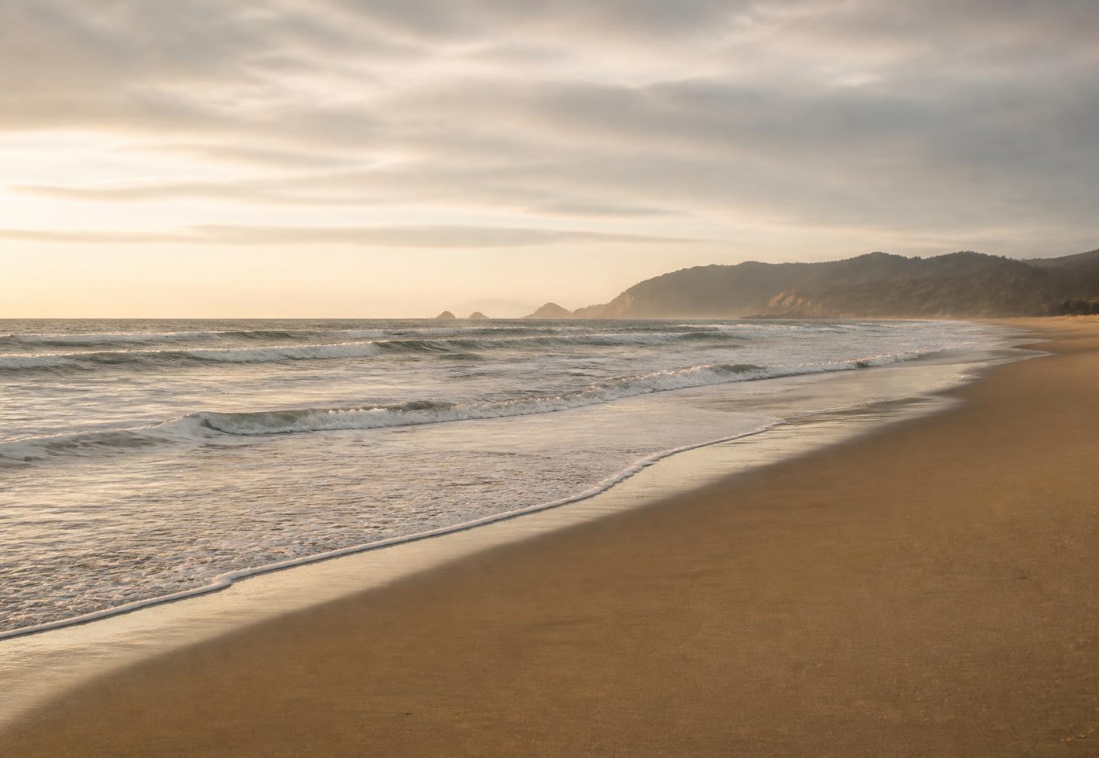 The shoreline at Rockaway Beach at golden hour